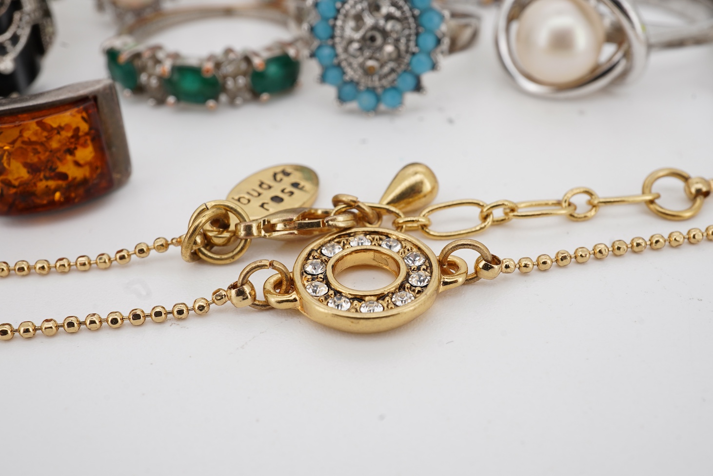 Assorted jewellery including a 925, black onyx and marcasite set Art Deco style ring, three other 925 rings, a pair of 925 amber ear studs and a 925 brooch, together with four costume rings and a costume bracelet.